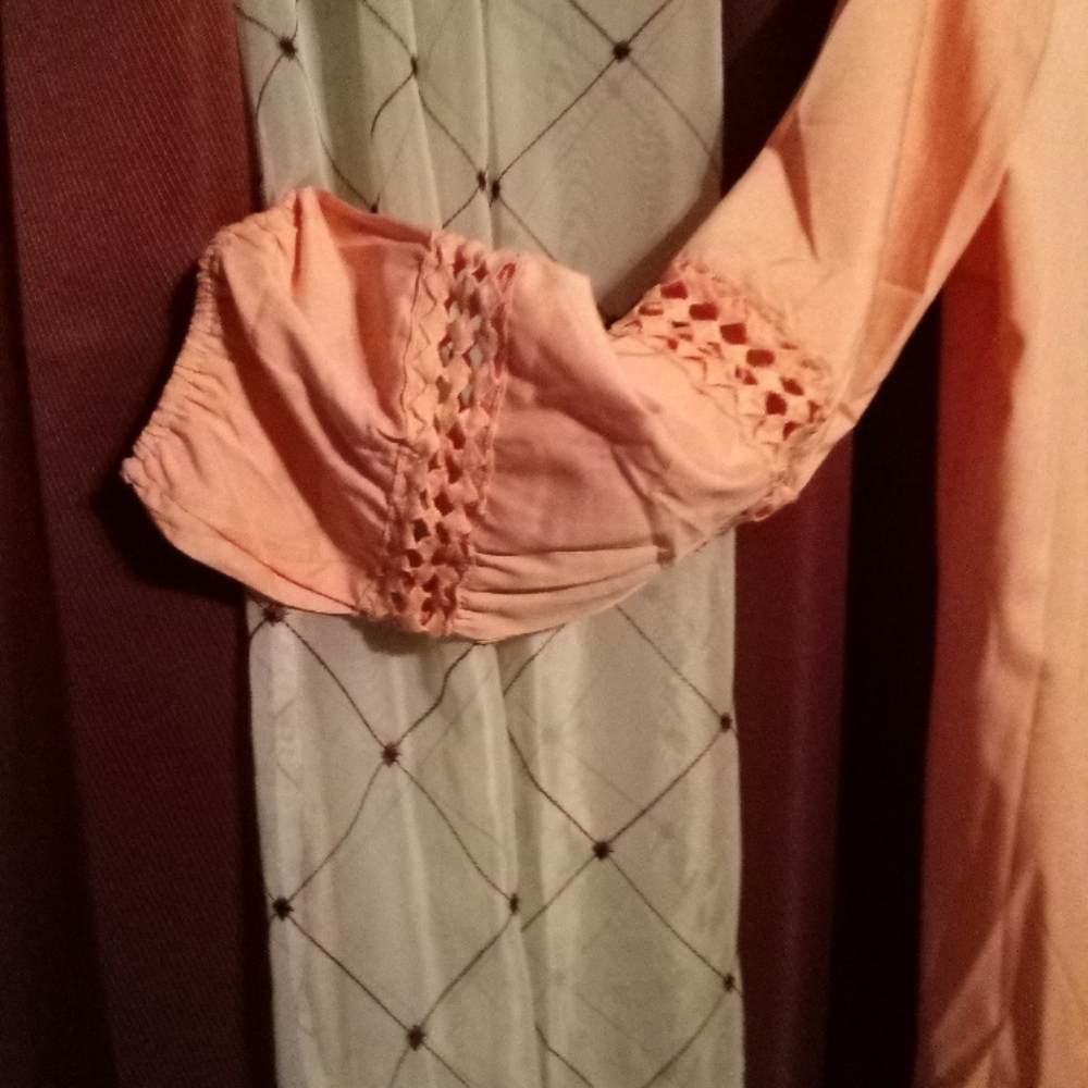 Cute lady's top with long sleeve v-neck with diamond cutouts on sleeves and neck